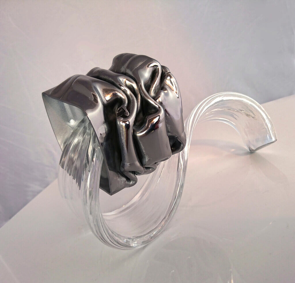 Photo sculpture Lächer-prise. Acier, verre – 15 x 12 x 9 cm